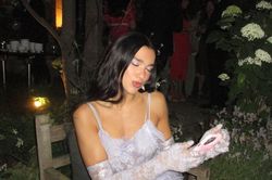 Dua Lipa gây tranh cãi vì mặc váy xuyên thấu màu trắng dự lễ cưới