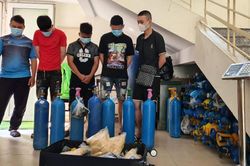 Phát hiện 77 bình ''khí cười'' từ vụ phá ''động bay lắc'' trong chung cư ở Nam Từ Liêm