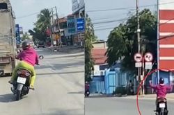 Xác minh người phụ nữ lái xe máy buông 2 tay, lạng lách, đánh võng trước đầu xe tải