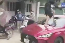 Khởi tố người phụ nữ đạp vỡ kính ô tô, cắn đứt tai tình địch