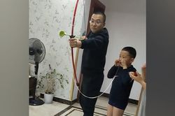 Người cha bắn cung để nhổ răng con trai ở Trung Quốc
