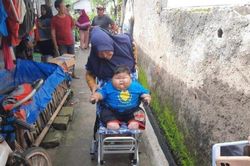 Bé trai 16 tháng tuổi nặng 27 kg, mặc vừa quần áo người lớn