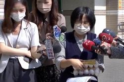 Nụ cười gây chú ý của cô gái Trung Quốc tìm lại được trứng bị trộm