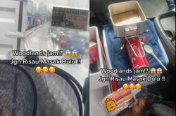 Kẹt xe quá lâu, tài xế nấu ăn trong buồng lái xe tải