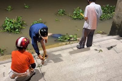 Hai thi thể dạt vào bờ sông Sài Gòn, một người mang theo cục bê tông