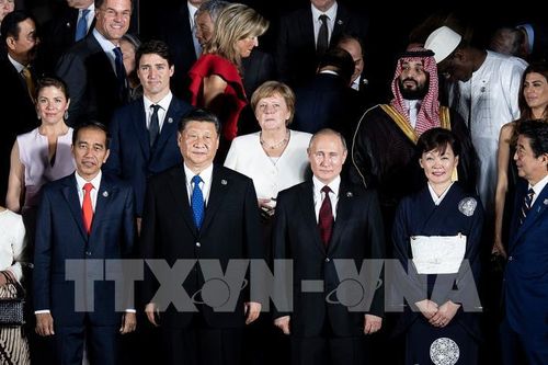 Chủ tịch Trung Quốc Tập Cận Bình (thứ 2, trái, trước) và Thủ tướng Canada Justin Trudeau (thứ 2, trái, hàng sau) tại Hội nghị thượng đỉnh G20 ở Osaka, Nhật Bản, ngày 28/6/2019. Ảnh: AFP/ TTXVN
