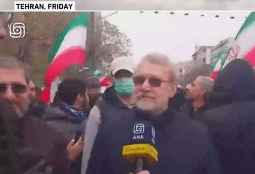 Ngày 13/3, ông Larijani tham gia cuộc tuần hành công khai tại Tehran. Ảnh: Al Jazeera.