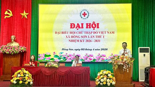 Chủ tịch Hội Chữ Thập đỏ xã Ngô Thế Tài thông qua Báo cáo chính trị trình tại Đại hội. Ảnh: Nguyễn Cường