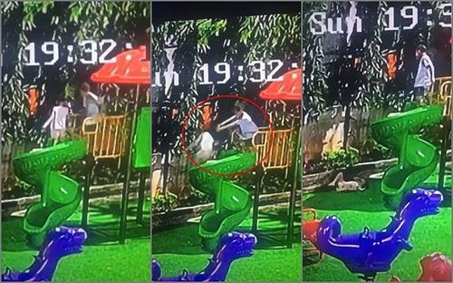Hình ảnh bé trai đẩy bé gái xuống từ cầu trượt cao 1,5m. Ảnh cắt từ clip.
