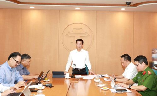 Quang cảnh cuộc họp giao ban về tiến độ xây dựng cơ sở dữ liệu đất đai trên địa bàn thành phố sáng 8-7. Ảnh: Hương Ly