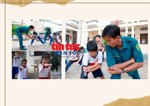 Các chiến sĩ dân quân trẻ tận tình hướng dẫn trẻ em qua từng động tác võ để rèn luyện sức khỏe.