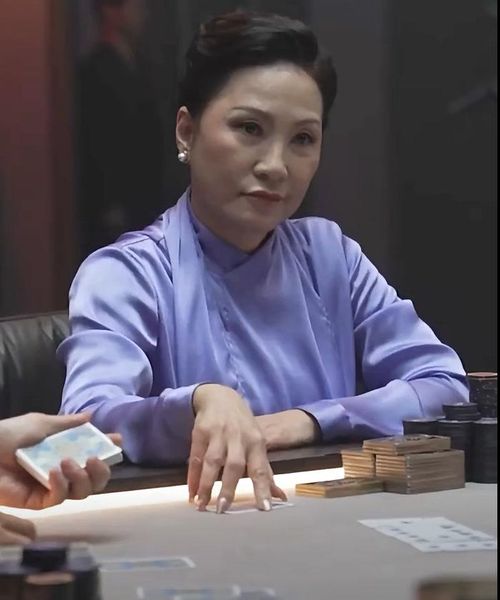 Hồng Đào hóa thân thành Chủ tịch Thảo, nữ doanh nhân quyền lực trong Tazza 4: The Song of Beelzebub. Ảnh: NSX