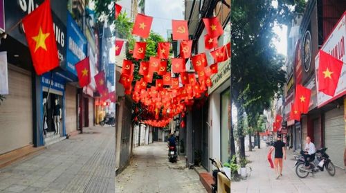 Sắc cờ rực rỡ trong từng con ngõ nhỏ, tạo không khí hân hoan chào mừng ngày lễ lớn. Ảnh: HT