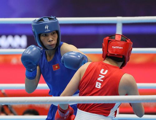 Tuyển thủ Hà Thị Linh (trái) tại ASIAD 20. Ảnh: BÙI LƯỢNG