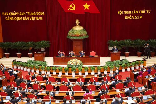 Trung ương biểu quyết thông qua chương trình hội nghị. Ảnh: TTXVN