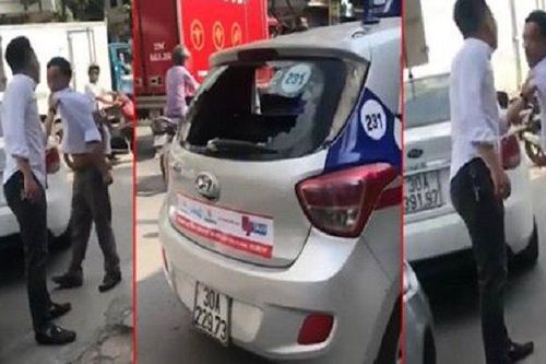 Lùi xe trúng taxi, nam thanh niên còn đập đầu tài xế vào đuôi xe