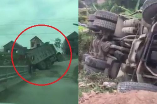 Xe ben mất phanh tụt xuống dốc rồi lật ngang