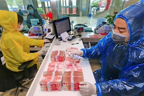 WHO khuyến nghị hạn chế sử dụng tiền mặt để tránh Covid-19 lây lan