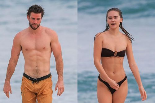 Liam Hemsworth tắm biển bên người tình trẻ