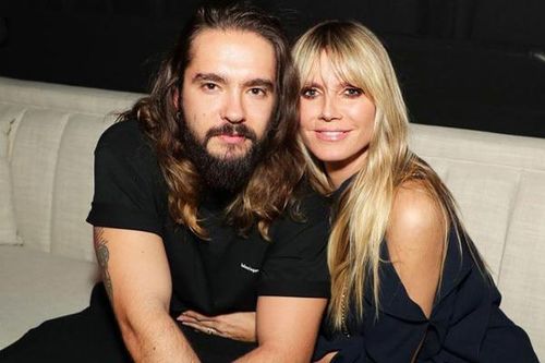 Siêu mẫu Heidi Klum hôn chồng qua cửa kính khi cách ly vì Covid-19