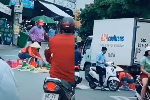 Bán rau ngay giữa vạch dành cho người đi bộ sang đường
