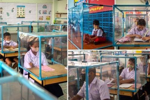 Đi học giữa mùa dịch, học sinh ngồi trong hộp nhựa để tránh COVID-19