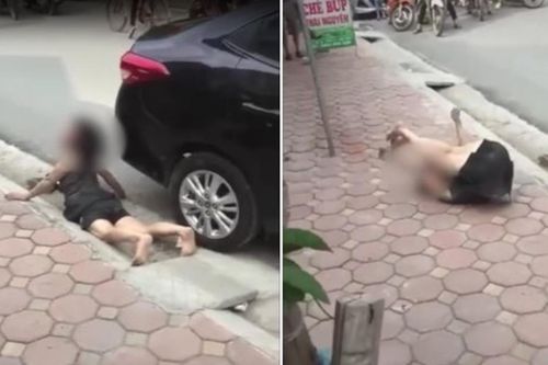 Clip: Nằm lăn lộn khóc lóc vật vã dưới gầm ô tô, người phụ nữ khiến đám đông kinh hãi