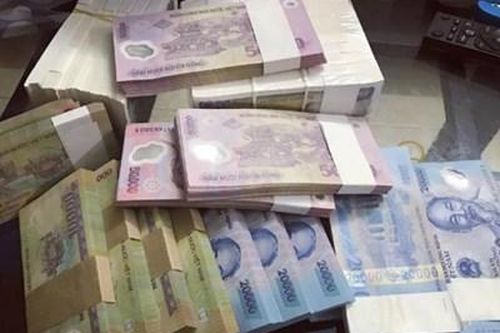 Đổi tiền lẻ dịp Tết Nguyên đán kiếm lời bị phạt bao nhiêu?