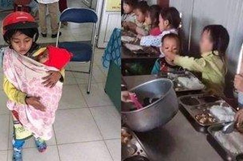 Cảm động bé gái 7 tuổi đội mũ bảo hiểm bế em đi tiêm phòng