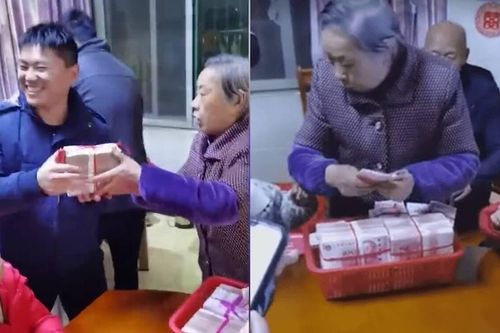 Lì xì theo 'phong cách bà nội', cầm cả giỏ tiền hơn 2,8 tỷ đồng mừng tuổi cho các cháu