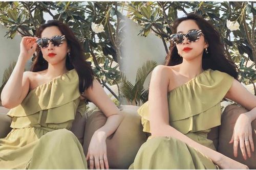 Hoa hậu Đặng Thu Thảo diện váy xanh lệch vai khoe xương quai xanh gợi cảm