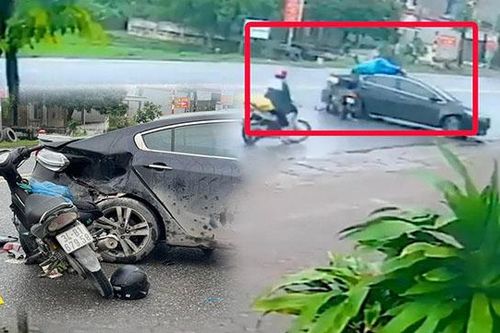 Xe máy lao thục mạng, nam thanh niên văng lên nóc ô tô nằm im