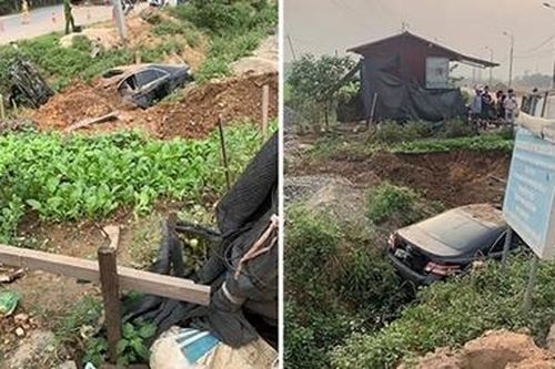 Tài xế máy múc cứu 3 người trong ô tô Camry mất lái lao xuống rìa đường bốc cháy