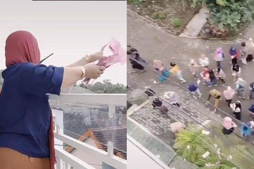 Người phụ nữ rải tiền triệu từ ban công xuống để nhân viên nhặt, nguyên nhân phía sau gây tranh cãi