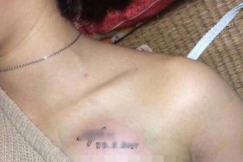 Nữ sinh xăm tên mình lên ngực có đáng bị buộc thôi học?