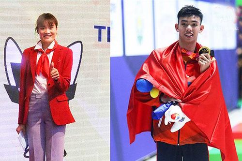 VĐV Quách Thị Lan và Nguyễn Huy Hoàng cầm cờ Đoàn thể thao Việt Nam tại Olympic Tokyo 2020