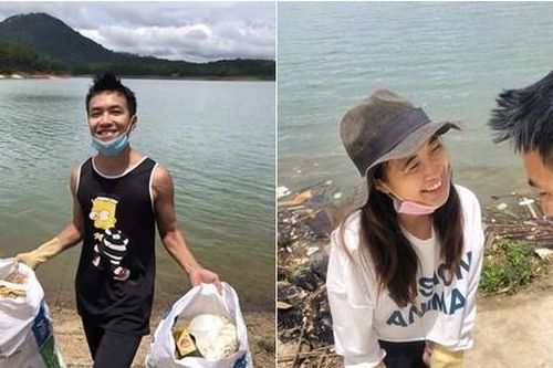 Vợ chồng trẻ dọn rác bảo vệ môi trường
