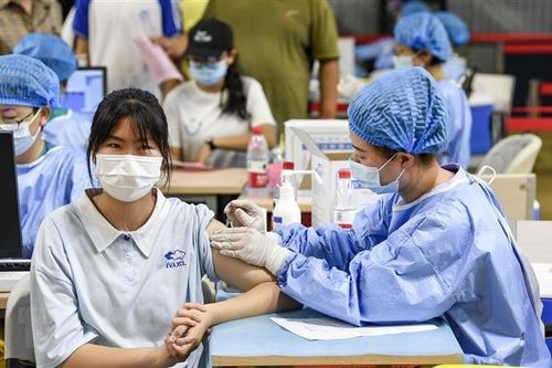COVID-19: Trung Quốc có thể đạt miễn dịch cộng đồng vào cuối năm