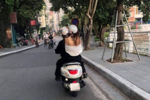 Cô gái xinh đẹp ăn mặc 'mát mẻ' dạo quanh khu vực Hồ Tây khiến dân mạng tranh cãi
