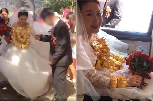 Thấy cô dâu đeo tới 60kg vàng trên người, khách mời lo lắng hỏi: 'Em có bị đau vai không?'