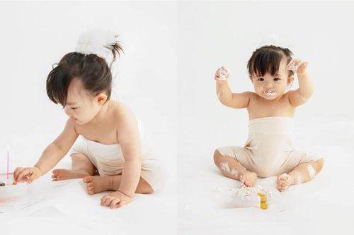 Sau khi là tâm điểm bộ ảnh của bố mẹ, bé Winnie đã mặc quần áo trong bộ ảnh sinh nhật 1 tuổi