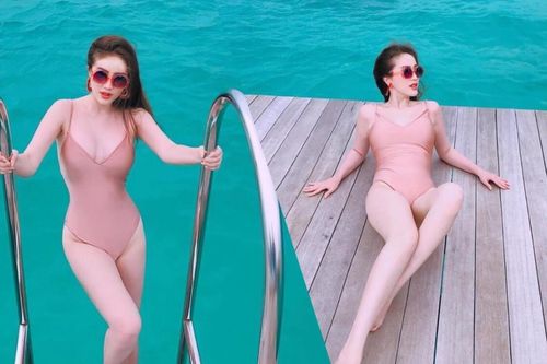 Thân hình đẹp nức nở của Bảo Thy mặc swimsuit bên cạnh biển
