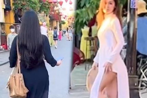 Nữ du khách mặc áo dài, quần đùi chụp ảnh ở Hội An khiến dân mạng bức xúc