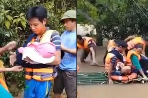 Người dân kết bè đưa cháu bé bị sốt xuất huyết vượt lũ dữ đi cấp cứu