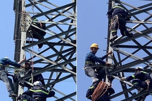 Giải cứu người phụ nữ leo cột điện cao thế