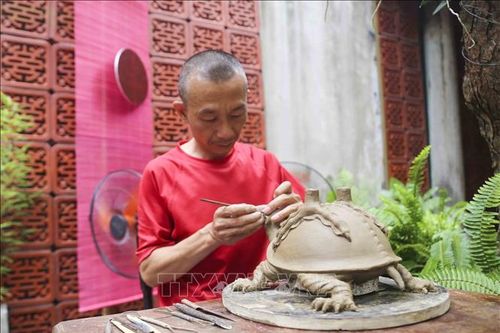 Hà Nội: Nghệ nhân đúc đồng Ngũ Xã trình diễn tại đình Kim Ngân