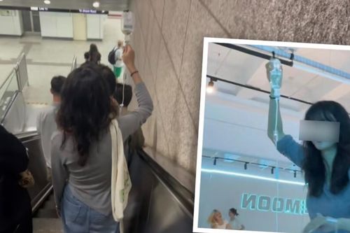 Cô gái truyền dịch trên đường đi làm khiến nhiều người thương cảm
