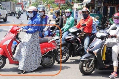 Ngã lún cột sống vì áo chống nắng cuốn vào bánh xe máy