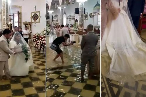 Đám cưới ngày mưa lũ, cô dâu, chú rể lội nước làm lễ trong nhà thờ