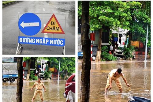 Vĩnh Phúc: CSGT TP Vĩnh Yên phân luồng giao thông tránh những tuyến phố ngập sâu, bảo đảm an toàn